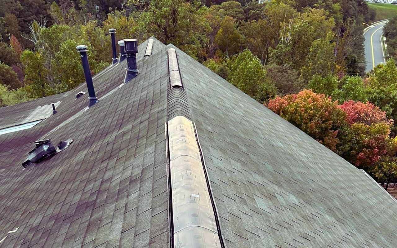 Professional roofer providing fall roof maintenance Virginia services